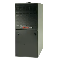 Black furnace unit with a vented top and access panel, dark gray exterior.