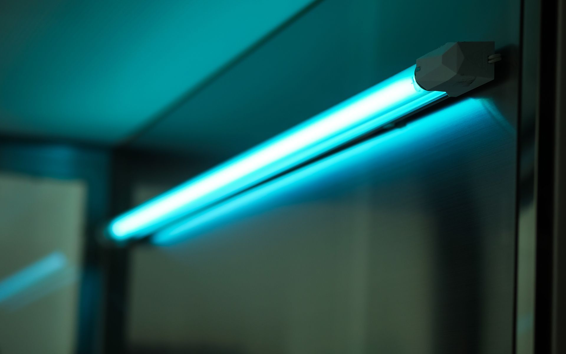 Blue UV light sanitizing a surface.