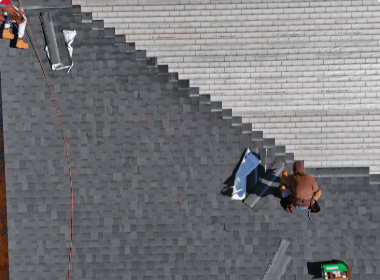 An aerial view of a person working on a roof