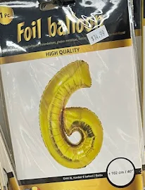 Yellow foil balloon shaped like the number 6 in retail packaging