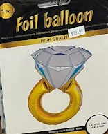 Foil balloon package showing a large diamond ring design with a gold band and clear gem