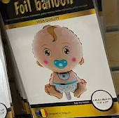 Foil balloon package featuring a cartoon baby in a diaper and pacifier on a white-and-gold box