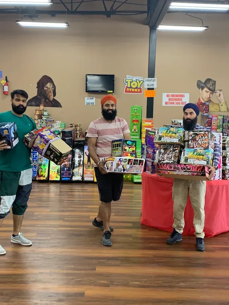 Three masked people holding toy gift bundles in a store, with Toy Story posters in the background.