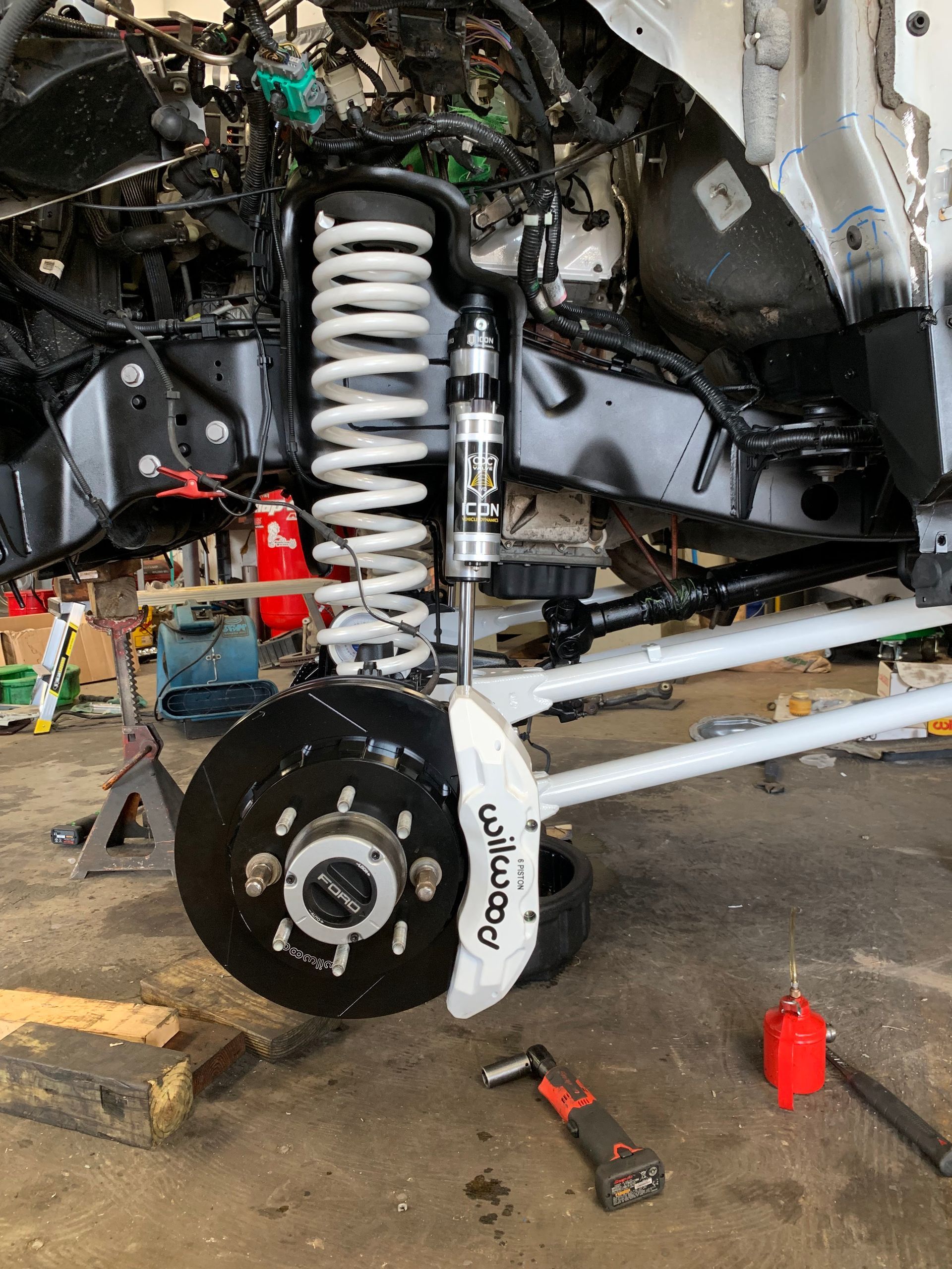 White truck suspension being assembled | Powerstroke Performance & Repairs
