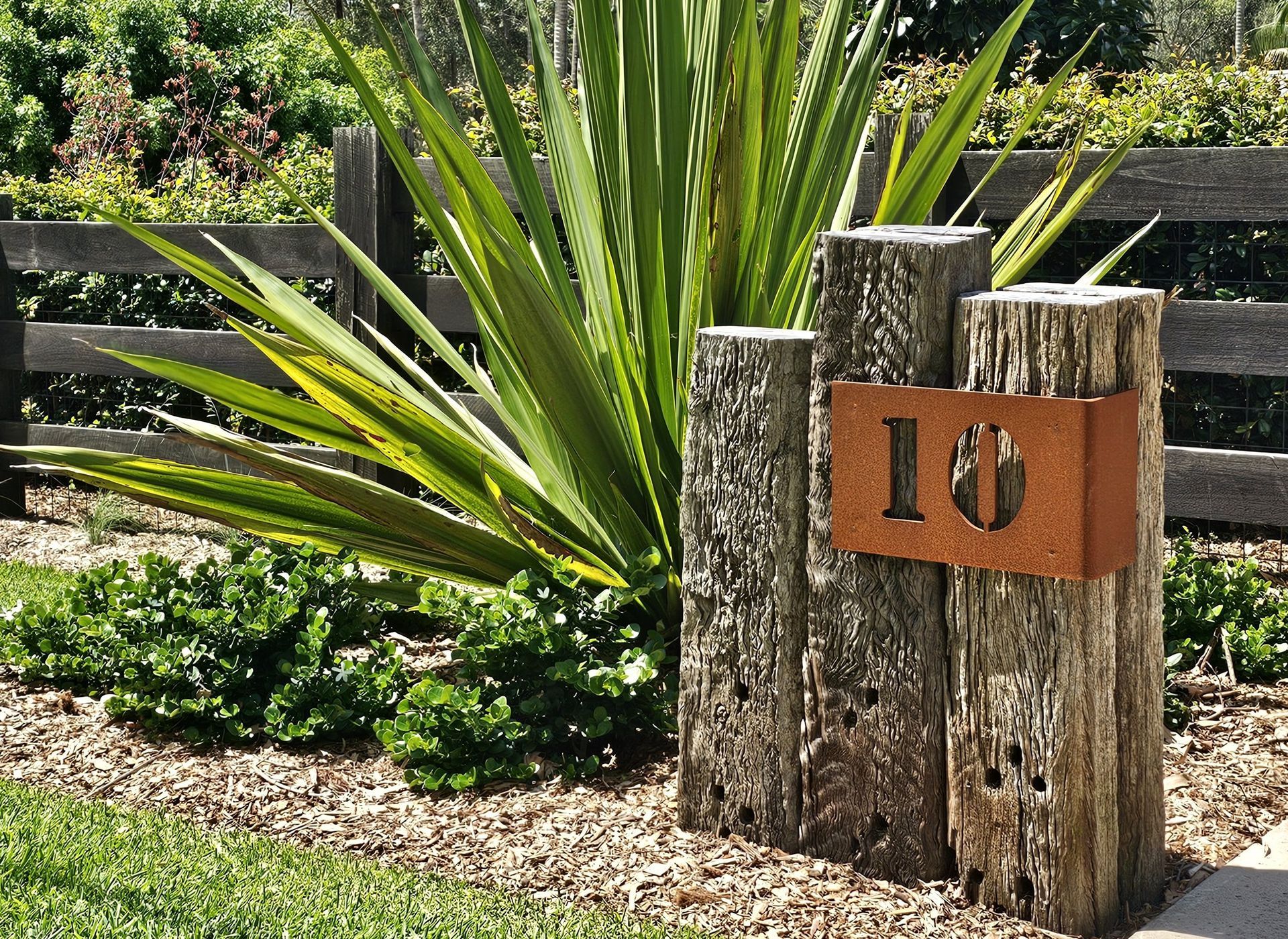 Rustic wooden mailbox post with address 