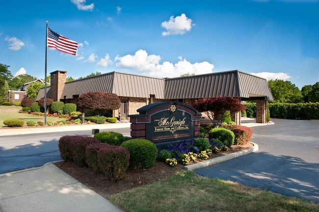 Sign and building with an American flag; 