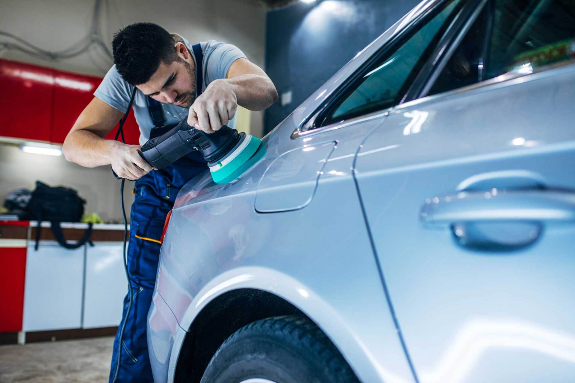 Young Man Polishing a Car — Watertown, MA — All Around Auto Body