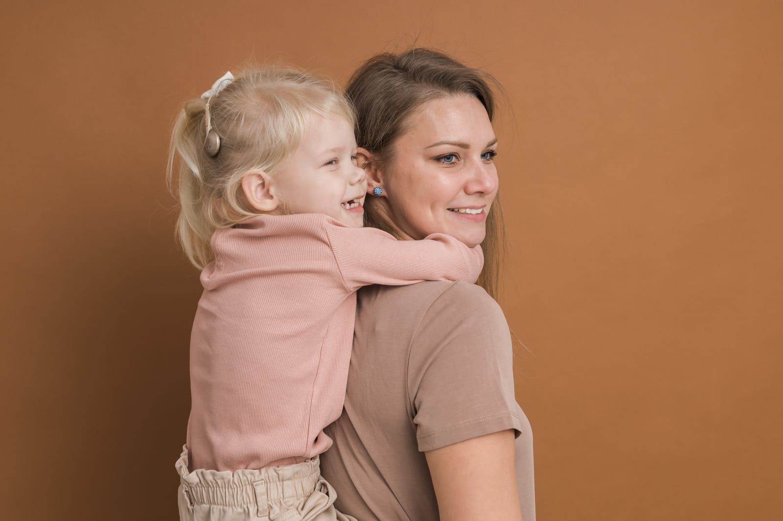 deaf-child-girl-with-cochlear-implant-studying-to-hear-sounds-and-have-fun-with-mother