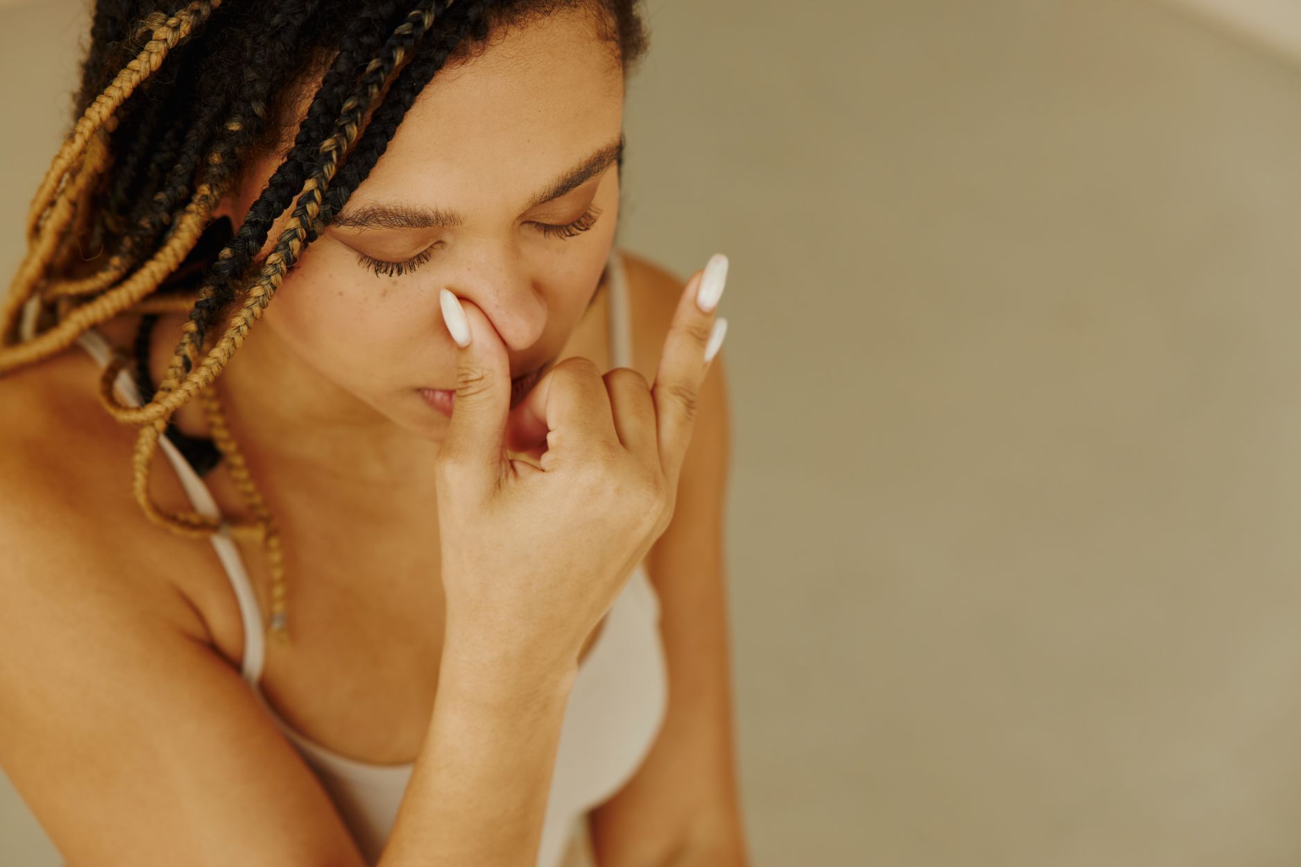 Woman suffering from nasal congestion