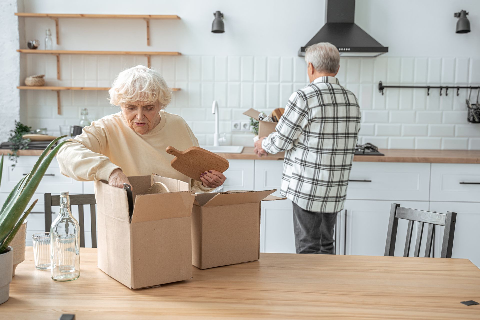 An elderly couple is moving into a new home.