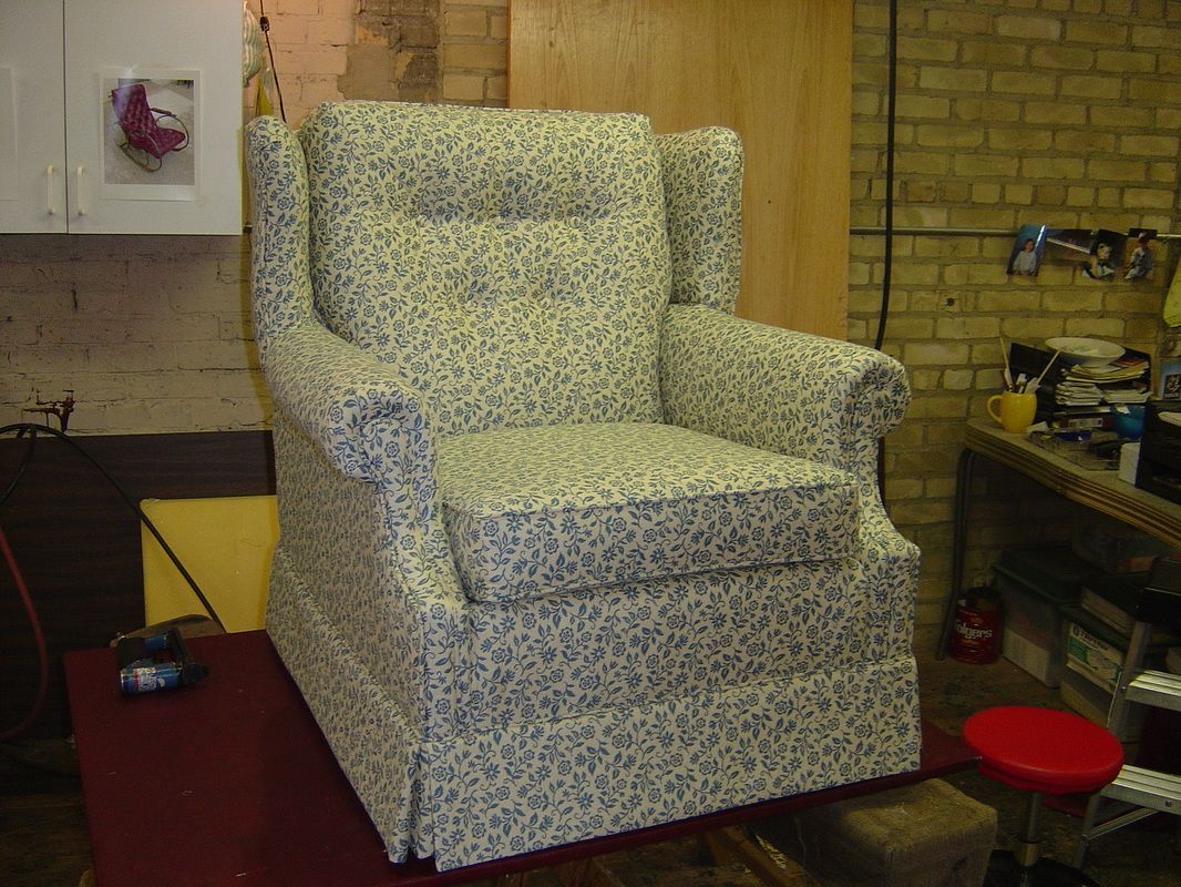 A chair is sitting on a table in a room.