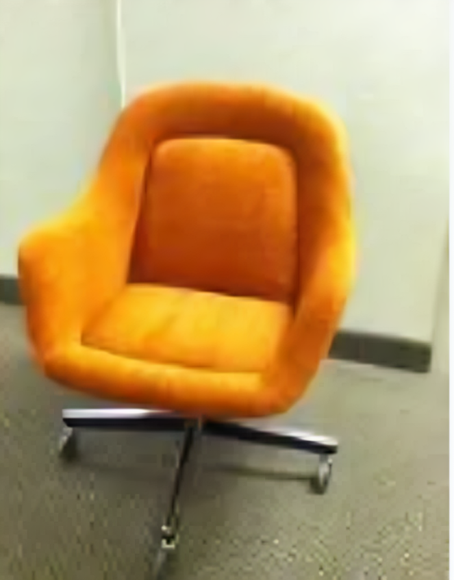 An orange office chair is sitting on a carpet in a room.