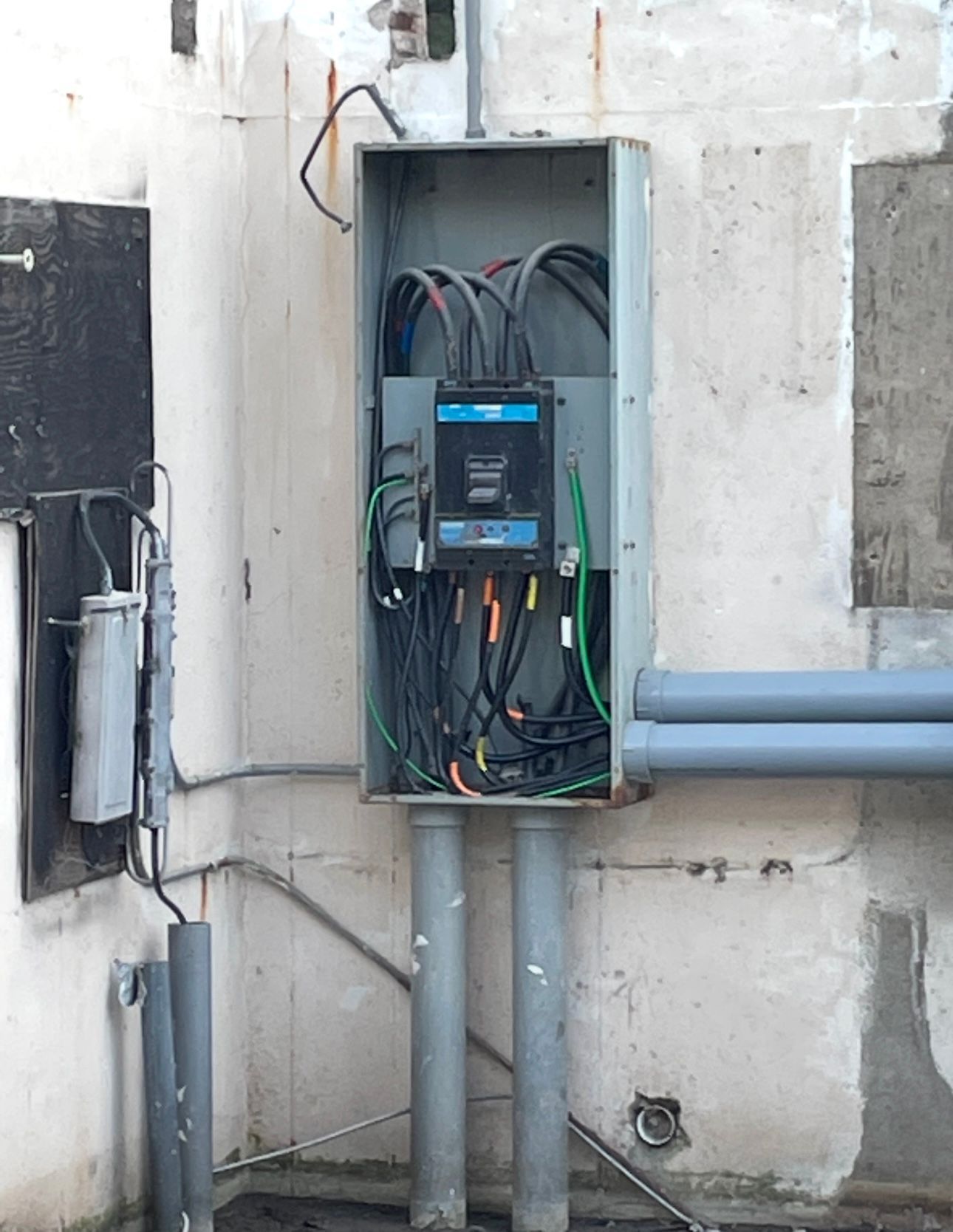 An electrical box with a lot of wires coming out of it