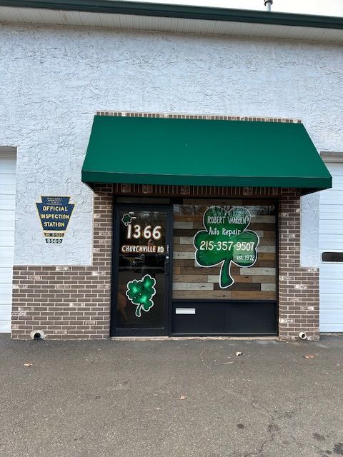 Building front with green awning; 