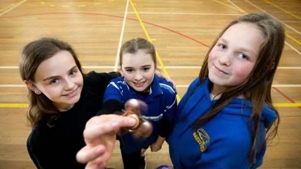 Most people fidget spinning in one place: world record set by Taranaki students (VIDEO) 