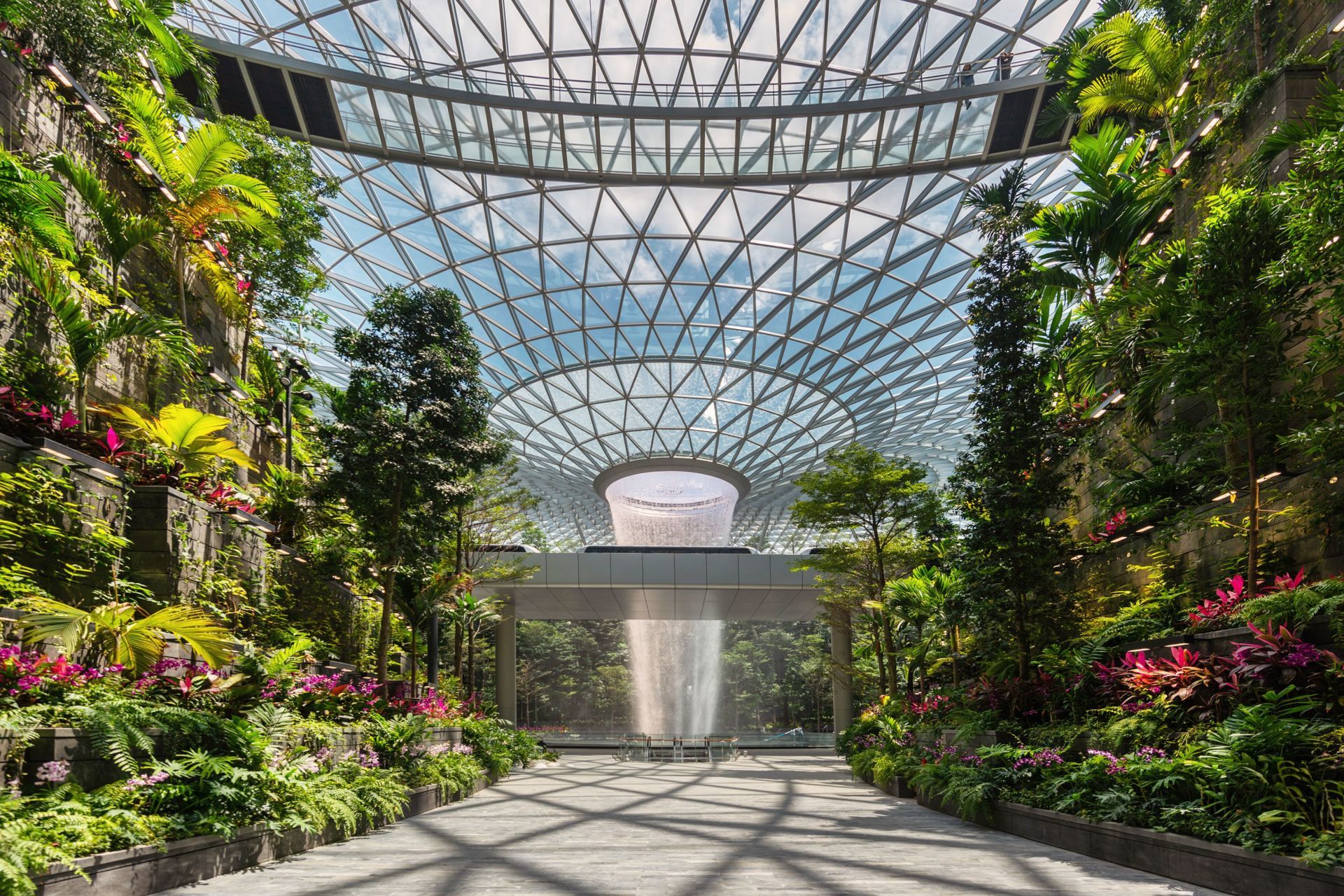  The Rain Vortex will pour rainwater down a seven-storey drop. The 40-metre-tall Rain Vortex – the world's tallest indoor waterfall – is the centrepiece of Singapore's soon-to-open Jewel Changi Airport, designed by Moshe Safdie's architecture firm. Photo by Peter Walker Partners Landscape