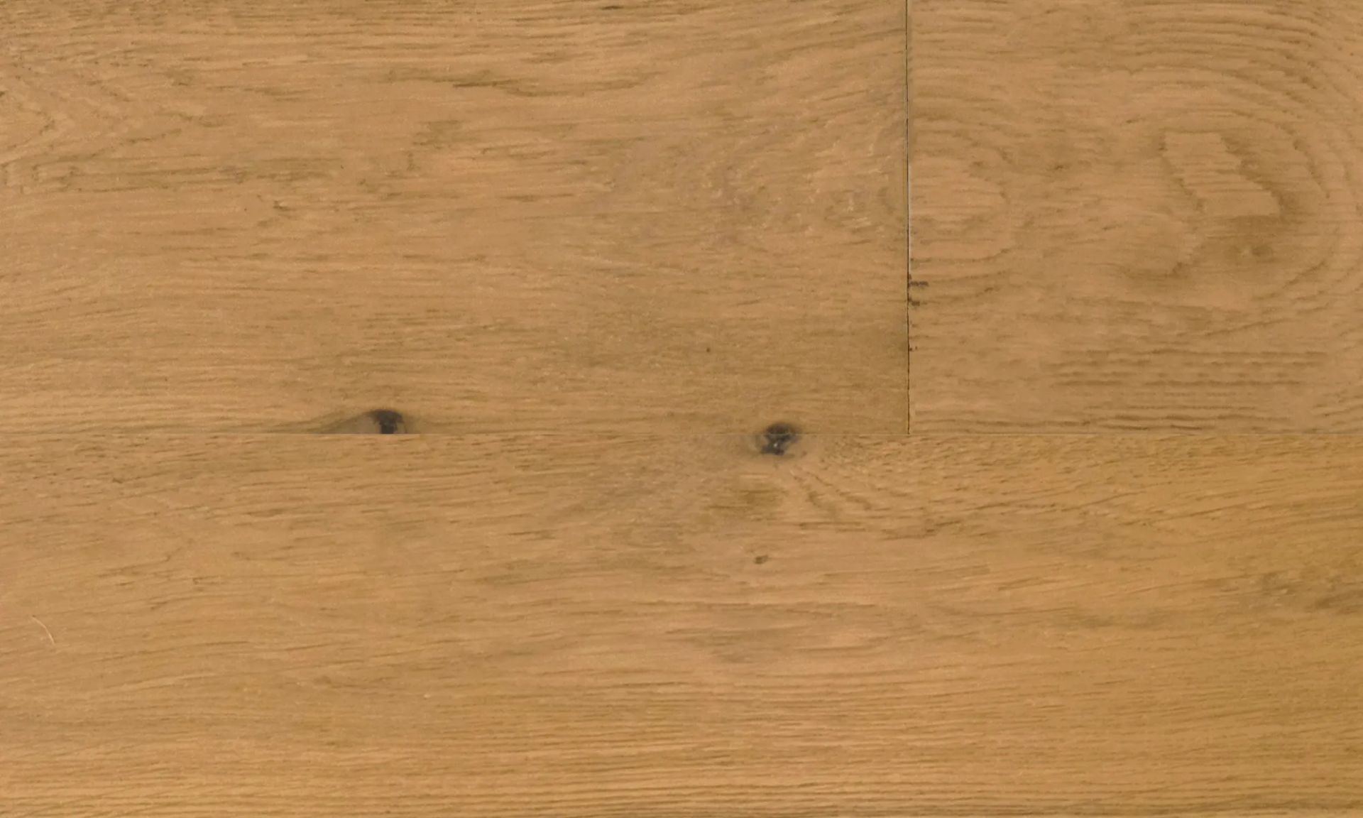 A close up of a wooden floor with a grain and texture.