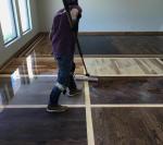 Man Cleaning Hardwood Flooring — Oklahoma City, OK — Temple Johnson Floor Company