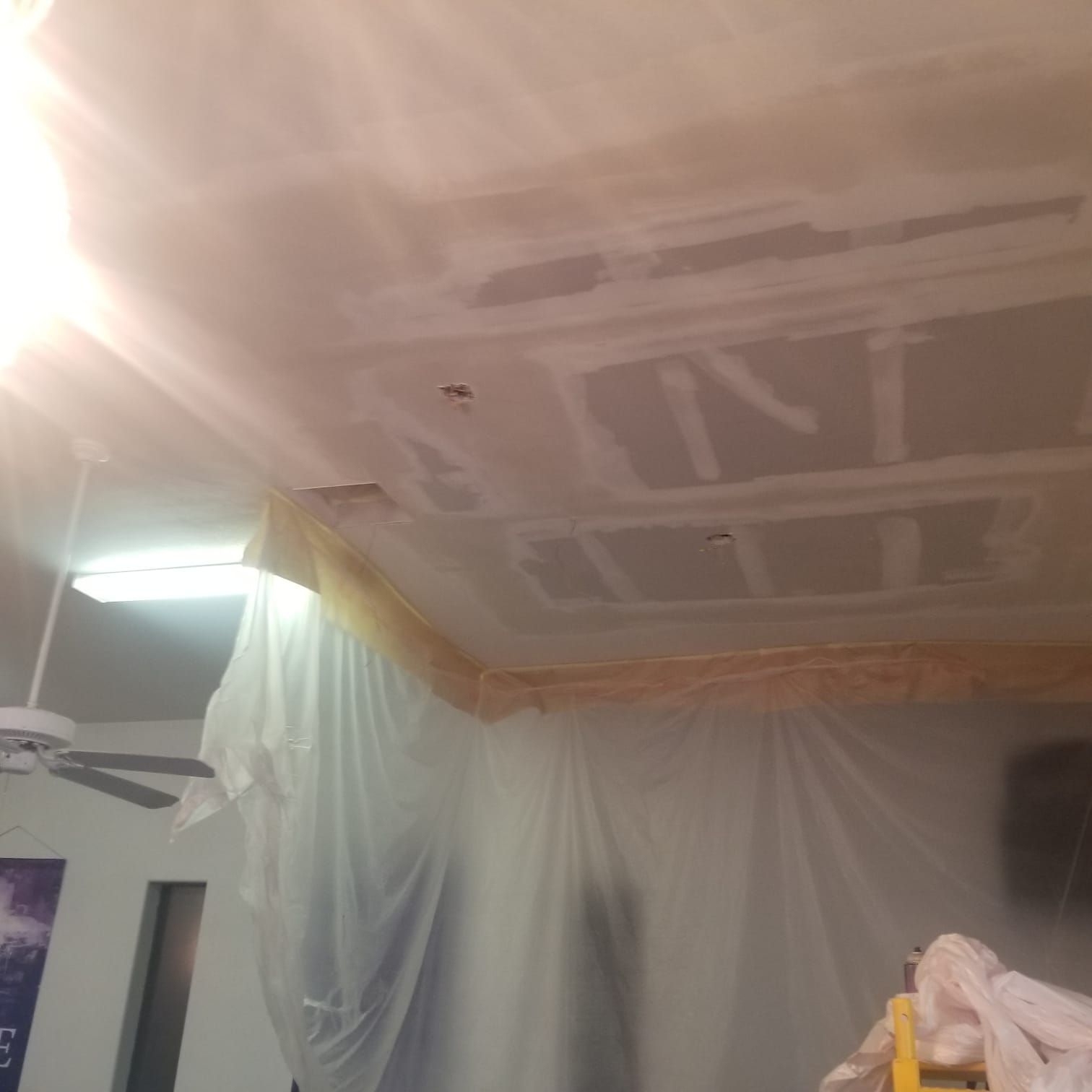 A room with a ceiling that has the word paint on it