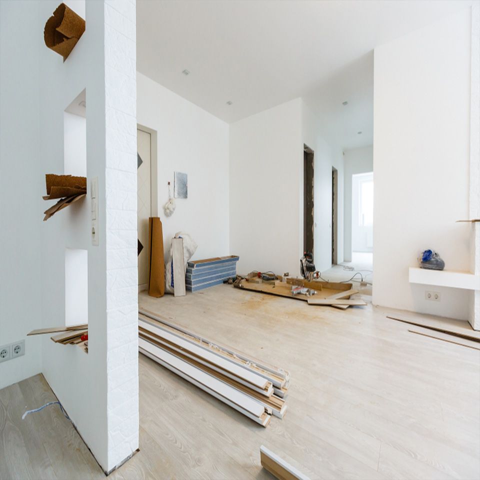 A room with a lot of pieces of wood on the floor