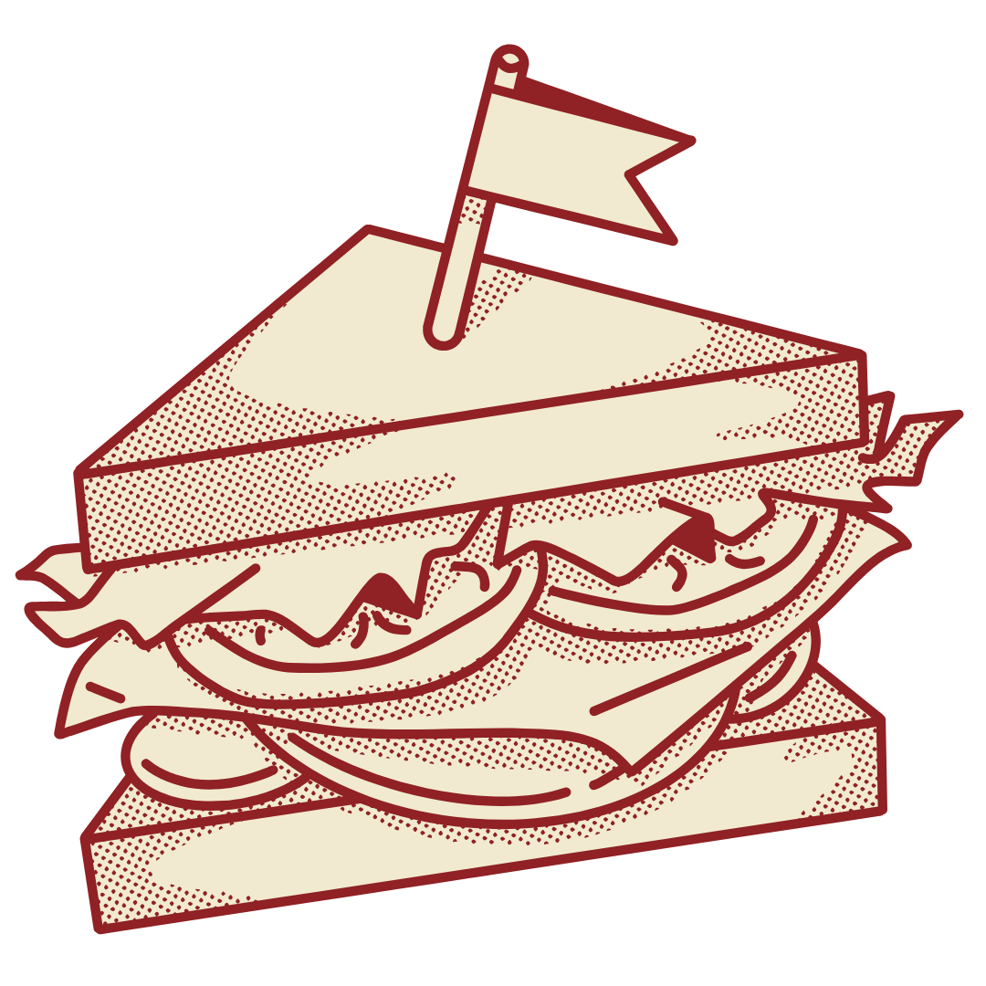 Sandwich with a flag, layered with lettuce, tomatoes, and meat.