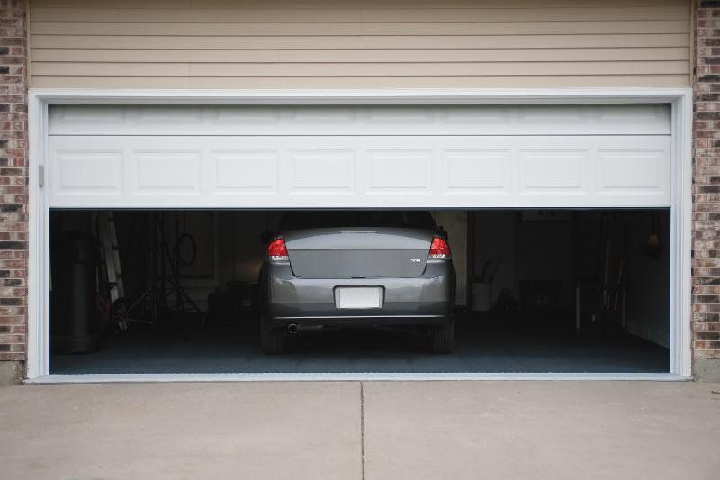 why does your garage door open on its own? 3 easy fix