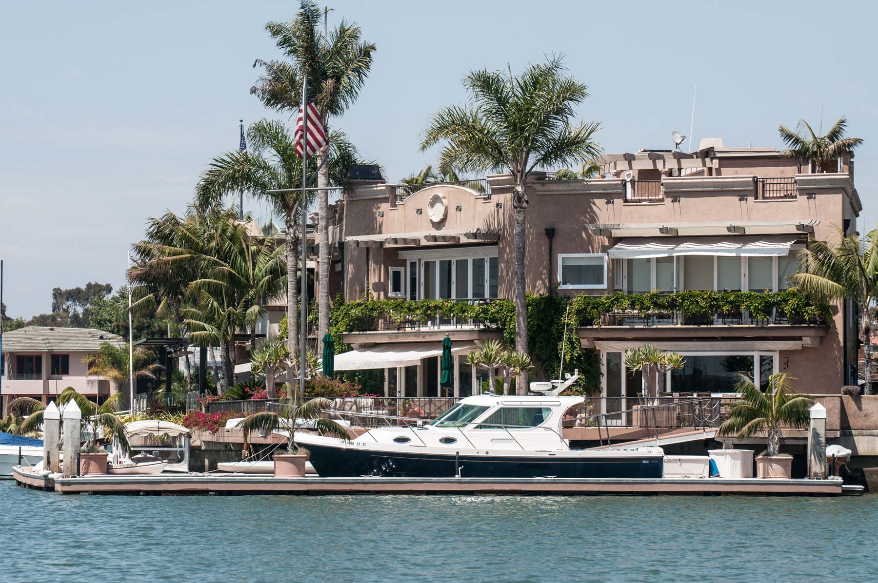 Yacht in front of Mansion in Newport Harbor