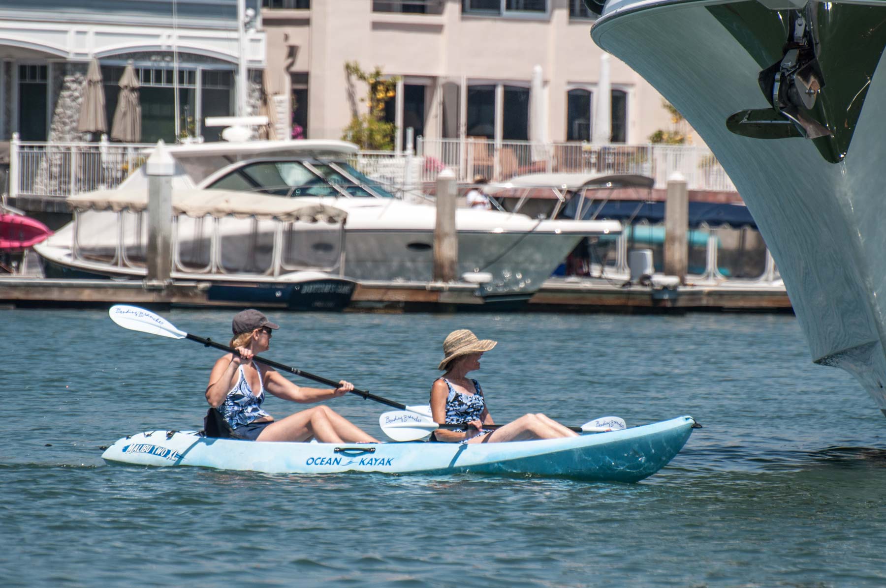 Two women on  a kayak in the Newport Harbor