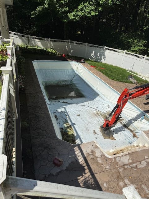 A bulldozer is cutting down trees in the woods.