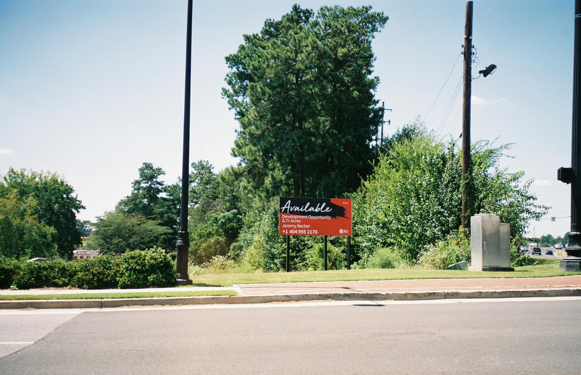 A sign on the side of the road says artists
