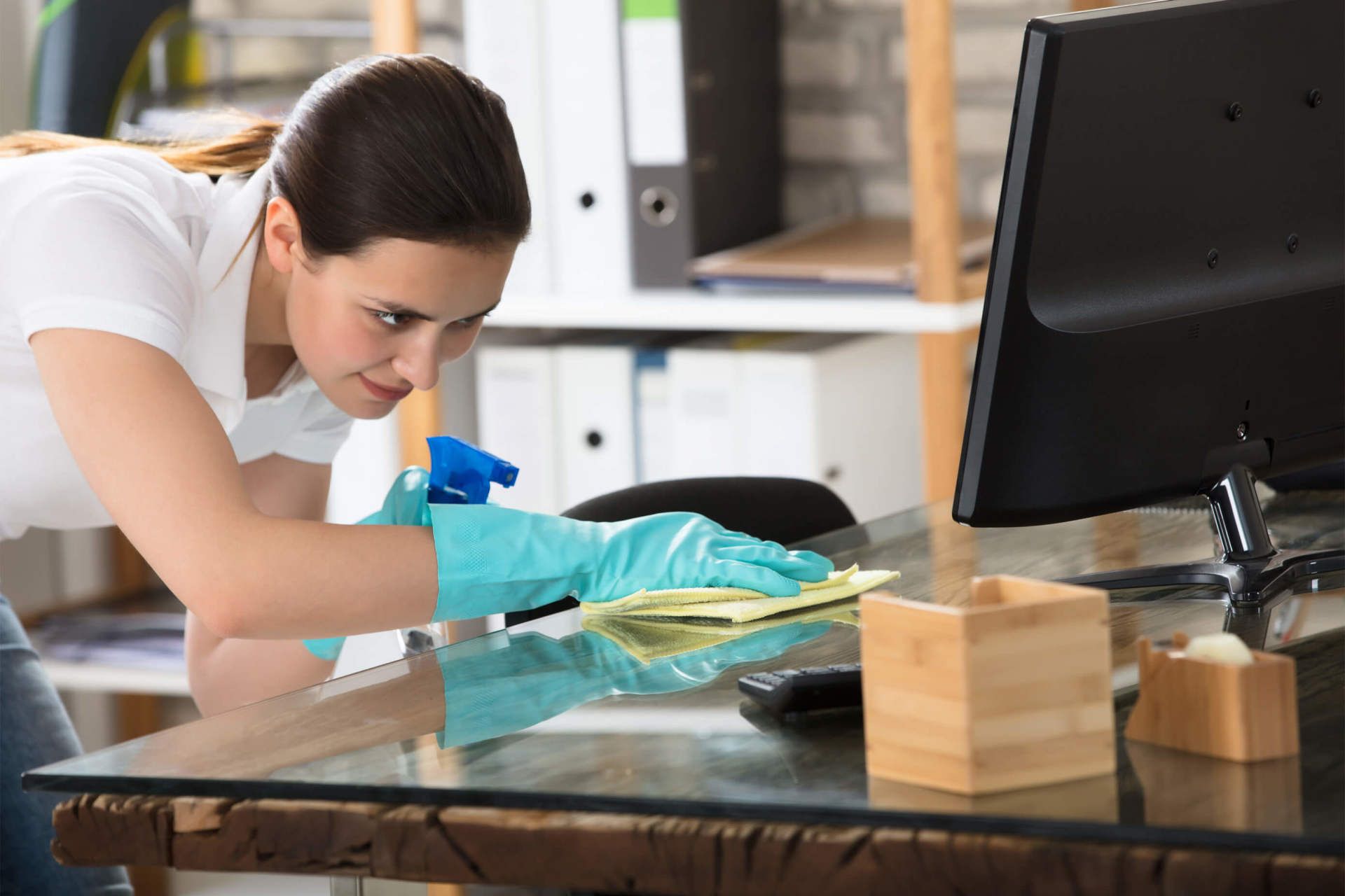 woman cleaning desk