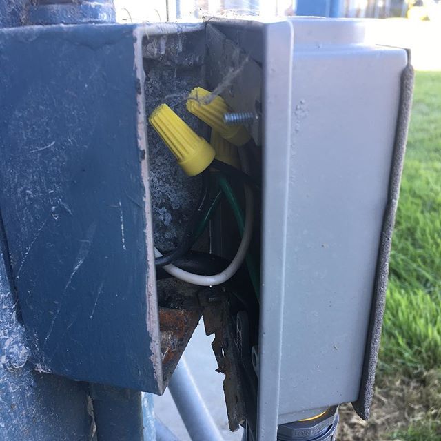 A close up of a box with wires coming out of it.