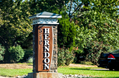 A stone monument sign reading A stone monument sign reading