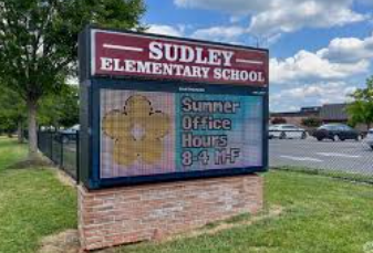 Sudley Elementary School sign displaying summer office hours of 8 to 4, Monday through Friday, with a yellow flower graphic. Sudley Elementary School sign displaying summer office hours of 8 to 4, Monday through Friday, with a yellow flower graphic.