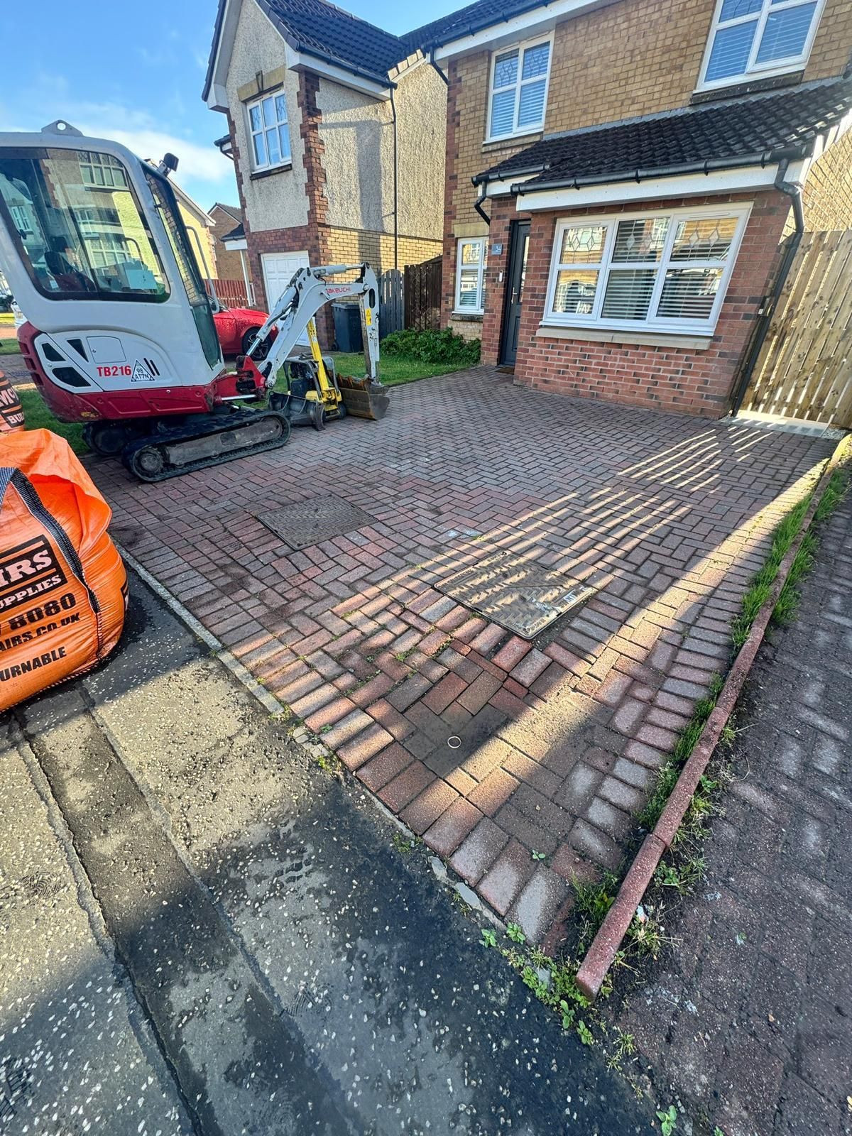 Before image of uneven Glasgow driveway and front garden Before image of an uneven Glasgow front garden and tired driveway area before monoblock driveway installation