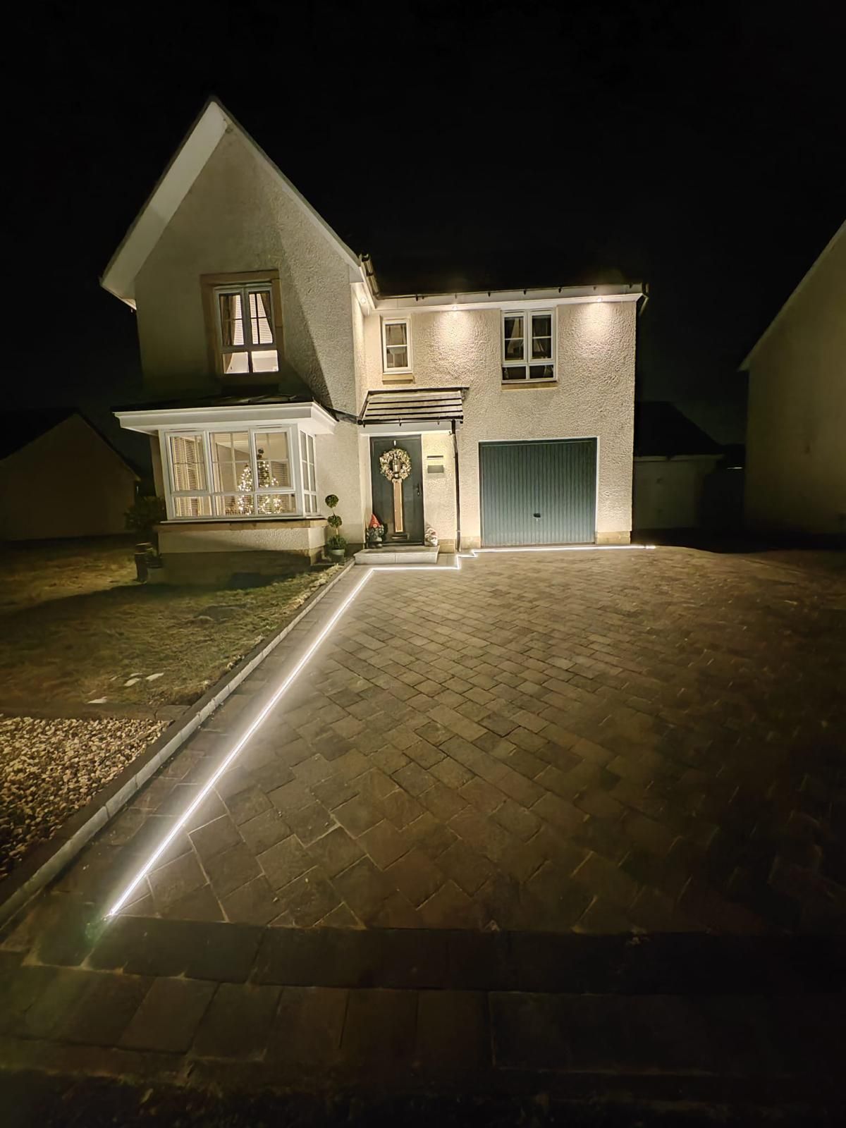 Monoblock driveway in Glasgow with integrated LED edge lighting for curb appeal