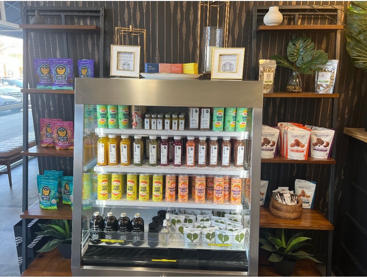 A group of black t-shirts that say health is true wealth