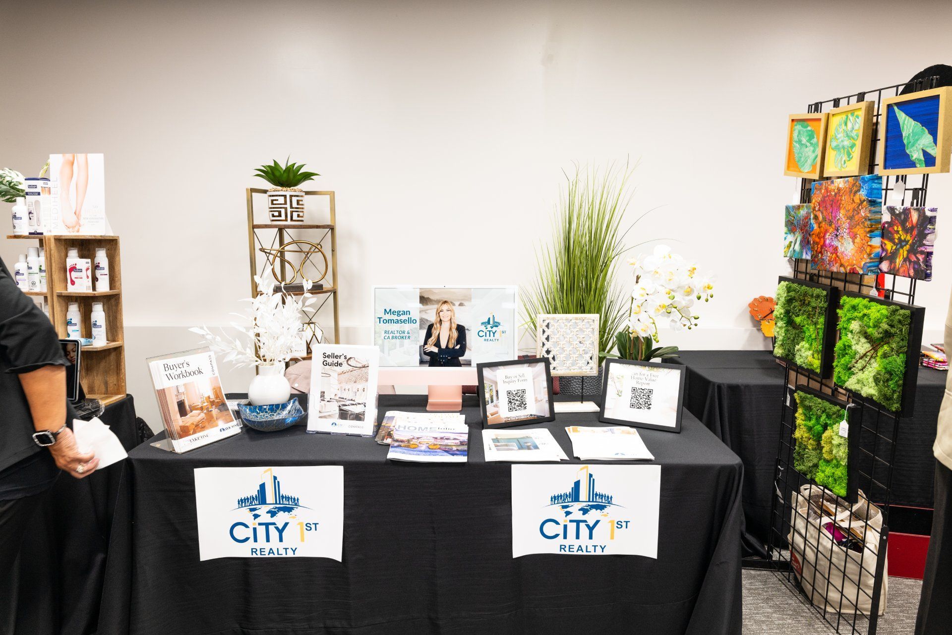 A table with a black table cloth and a sign that says city on it.