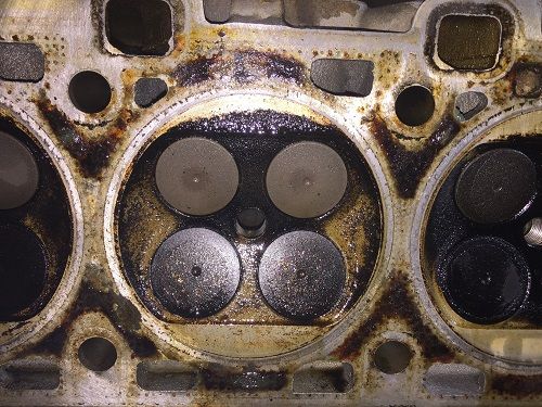 A close up of the inside of a car engine cylinder head - Sean's Auto Care