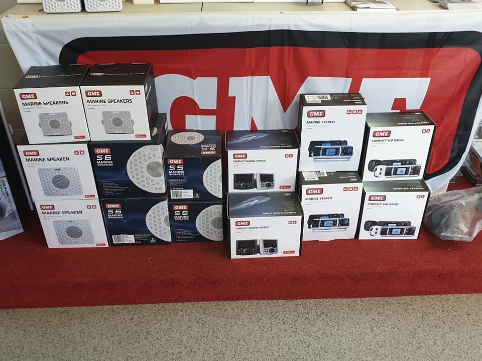 Boxes of GMI Brand Speakers and Audio Equipment Displayed on a Red Surface — Tolga Traders in  Tolga, QLD