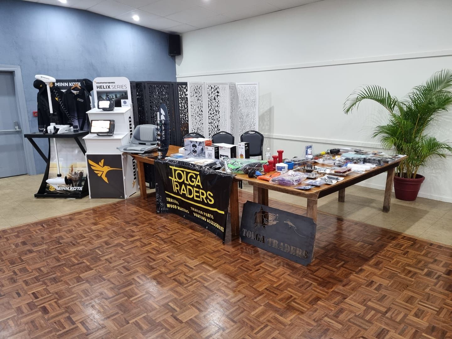 A Display Table With Various Items for Sale at a Trade Show — Tolga Traders in Tolga, QLD