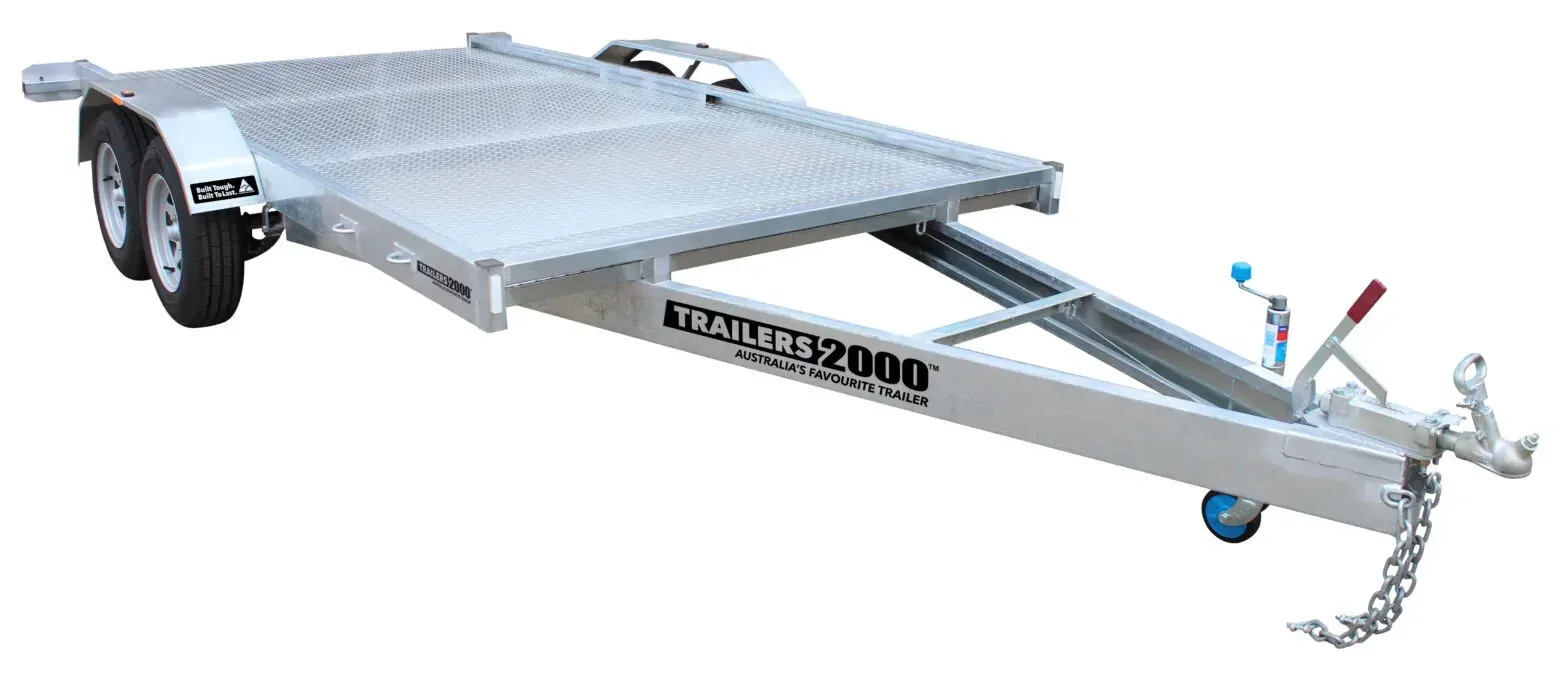 Silver car trailer with dual axles and a long ramp. — Tolga Traders in  Tolga, QLD