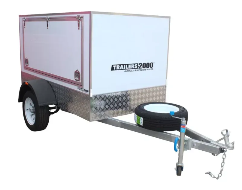 Box trailer with white storage compartment, spare tire, and silver frame. — Tolga Traders in  Tolga, QLD