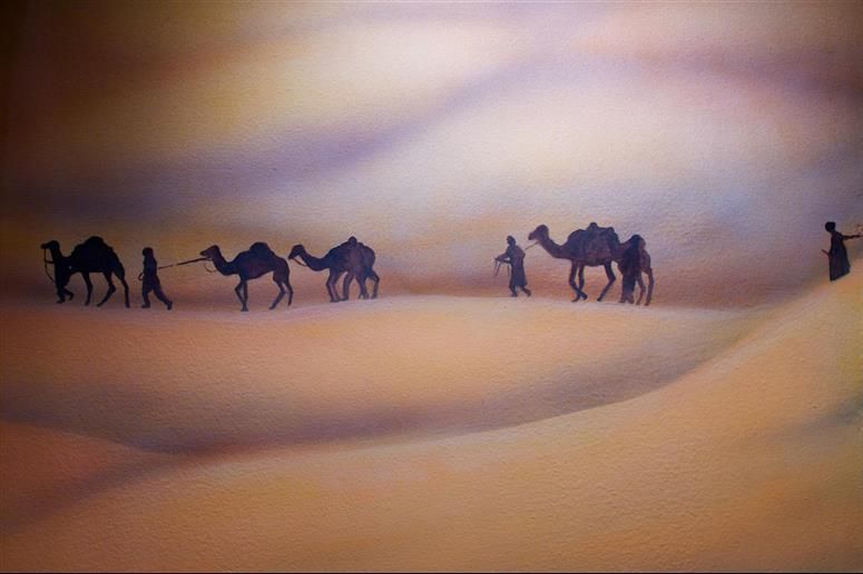 A painting of a herd of camels walking through a desert.