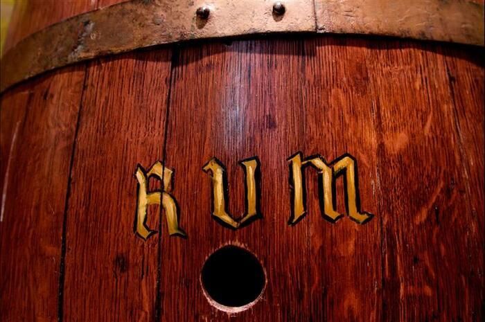 A wooden barrel with the word rum written on it