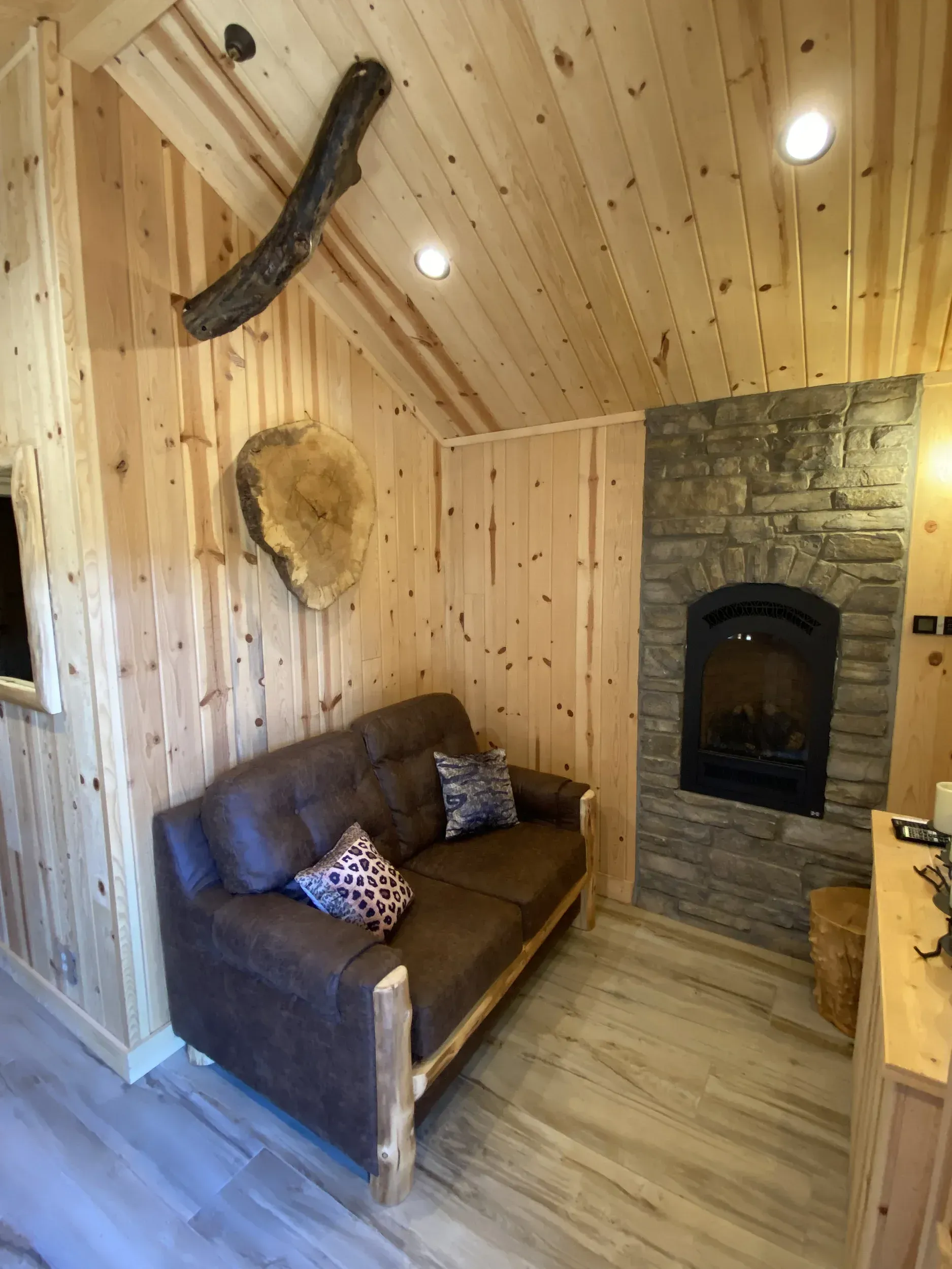 A living room with a couch and a fireplace