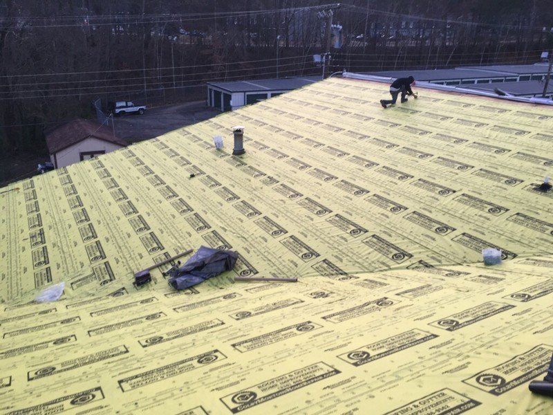 roofer working on roof