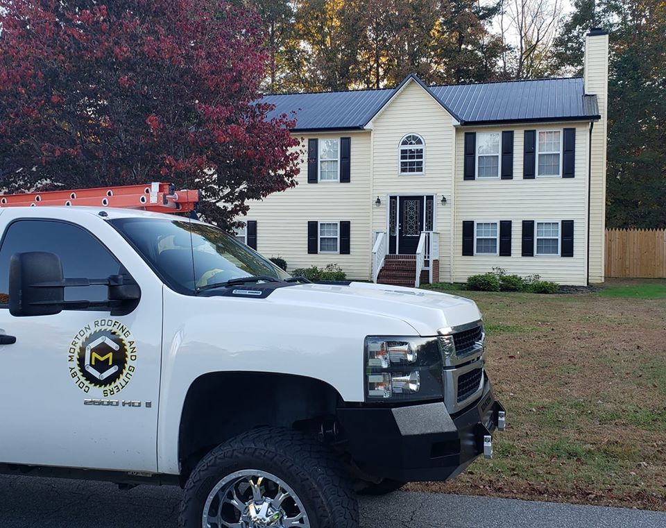 Colby's Roofing & Gutters van