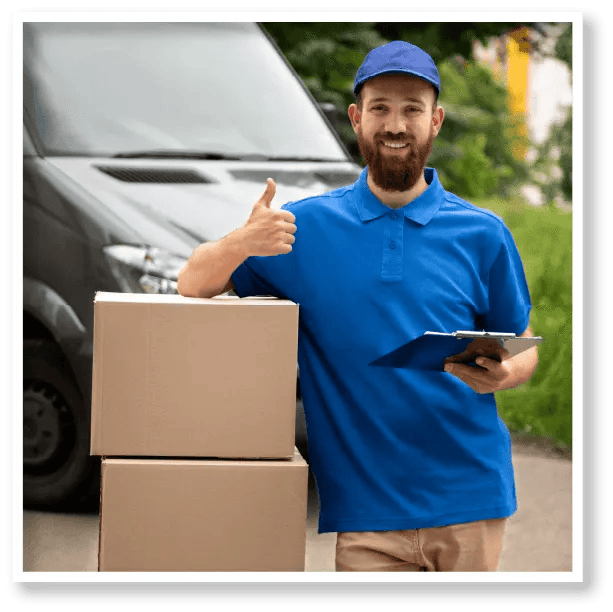 A delivery man is giving a thumbs up while holding a clipboard and boxes.