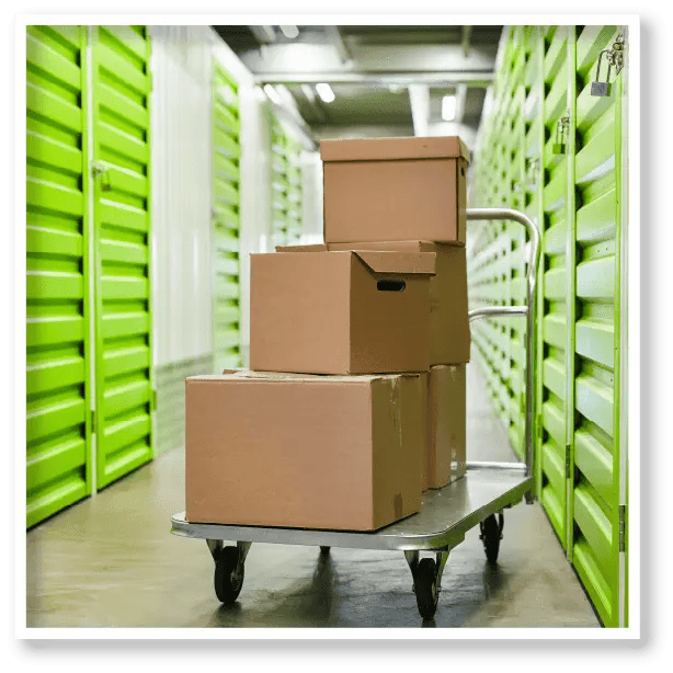 A cart filled with cardboard boxes in a storage room